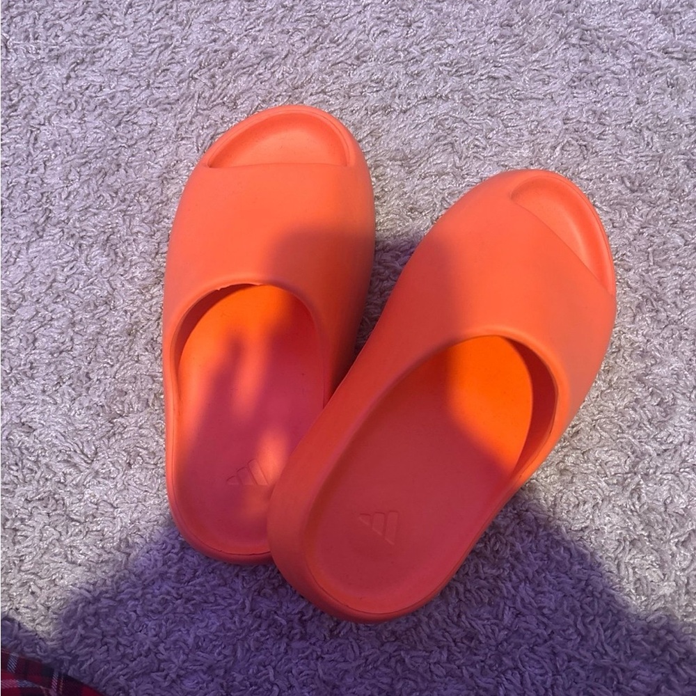 Yeezy slides in orange